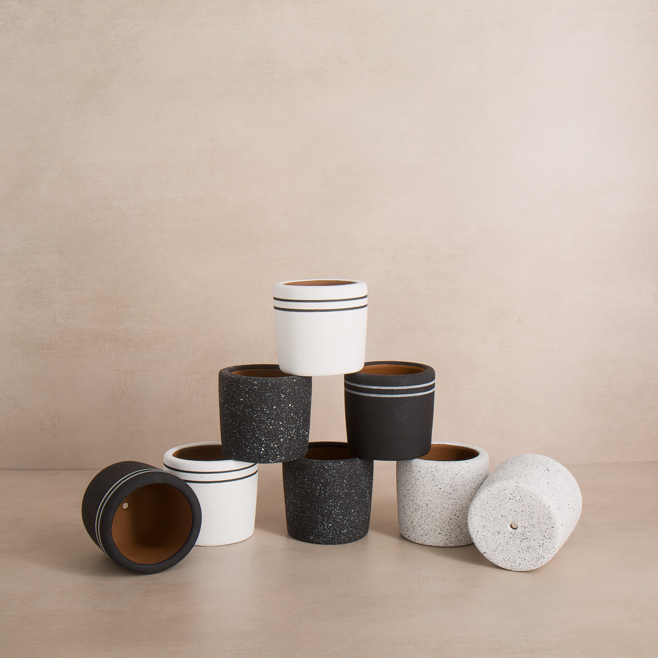 Handcrafted speckled and striped terracotta planters for succulents