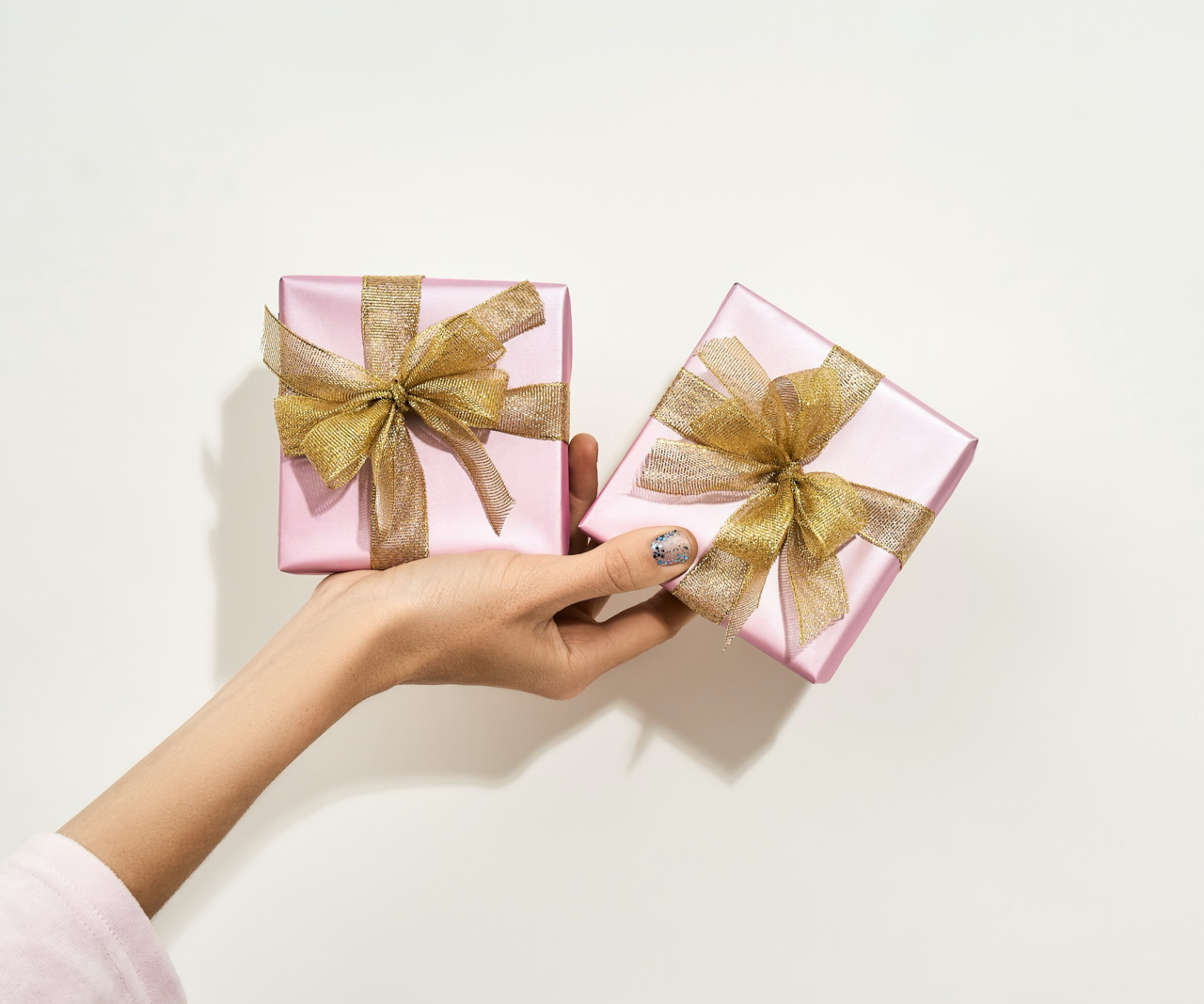 hand holding wrapped gifts