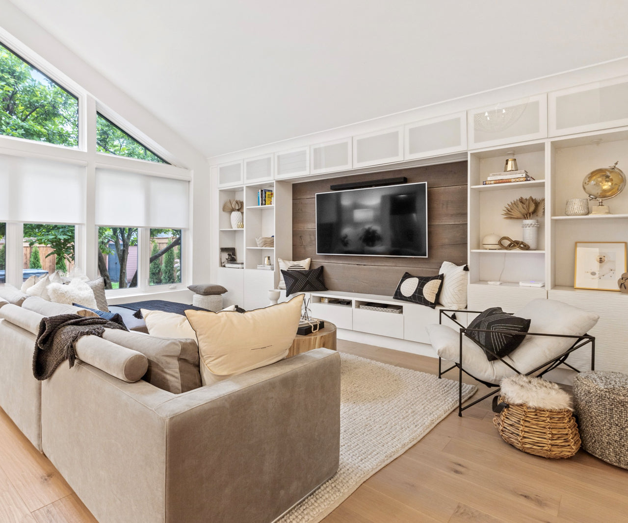 living room with shelves around tv