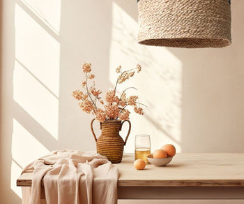 woven vase with flowers on wooden table