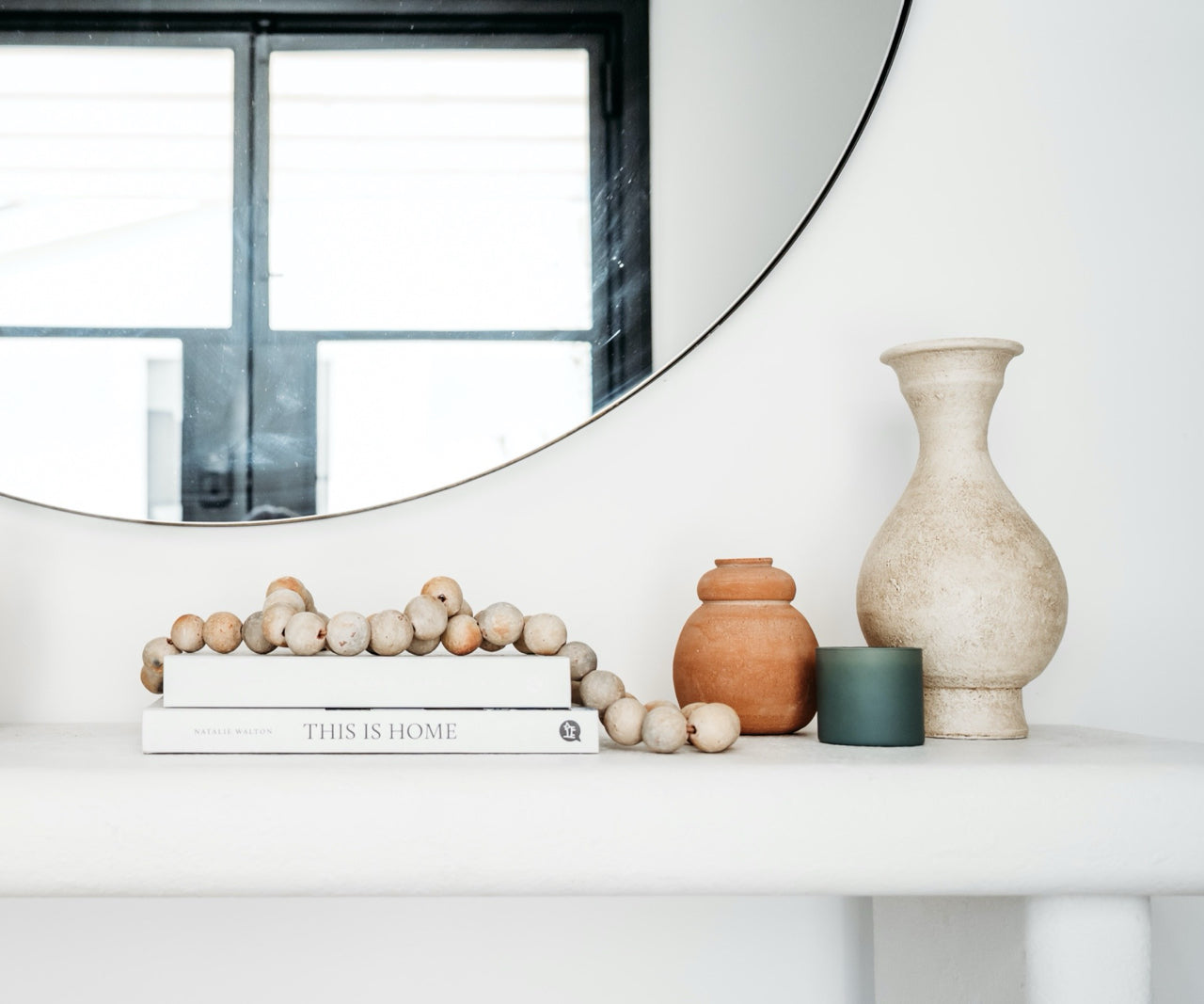 potted plants styled on a wood shelf